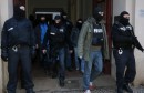 German special police units leave an apartment building in the Wedding district in Berlin