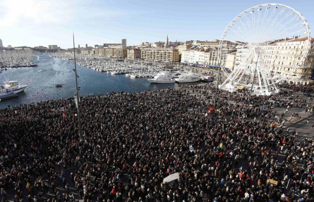 Several thousand people gather to pay tribute to victims of a shooting by gunmen at the office of the satirical weekly newspaper Charlie Hebdo during a demonstration in Marseille