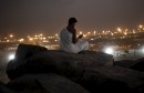 Muslim pilgrims pray on Mount Mercy on the plains of Arafat during the annual haj pilgrimage, outside the holy city of Mecca