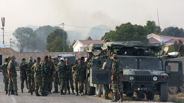Tunisian soldiers gather near the border with Algeria around Mount Chaambi