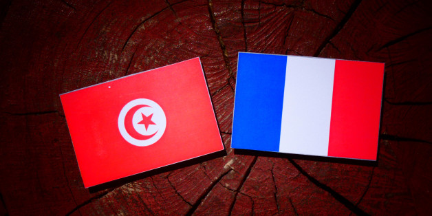 Tunisian flag with French flag on a tree stump isolated